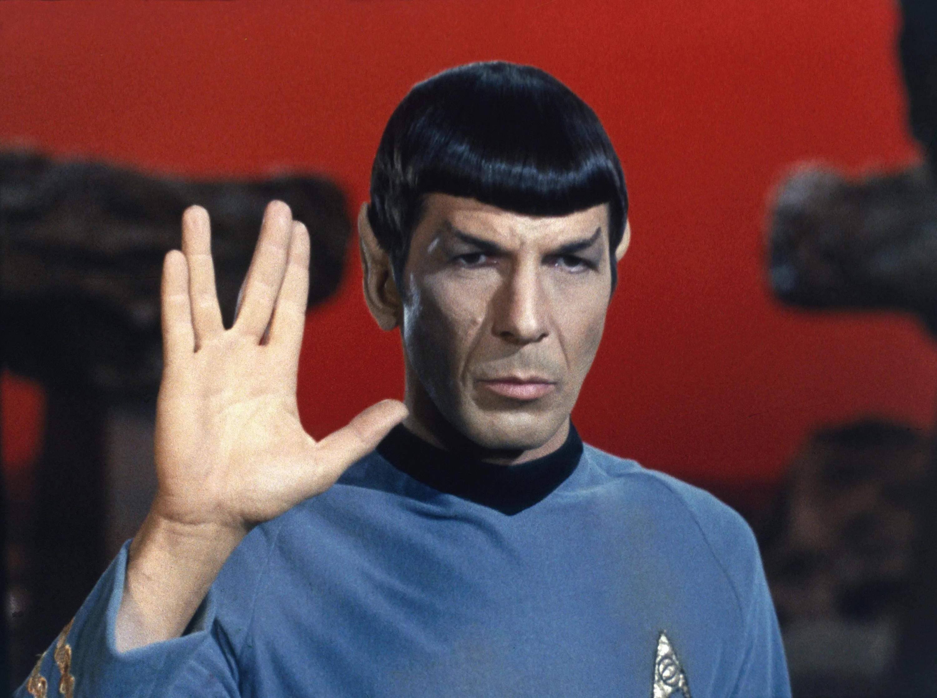 image of spock from star trek the original series in his famous 'live long and prosper' pose with his palm raised forward to symbolise the phrase